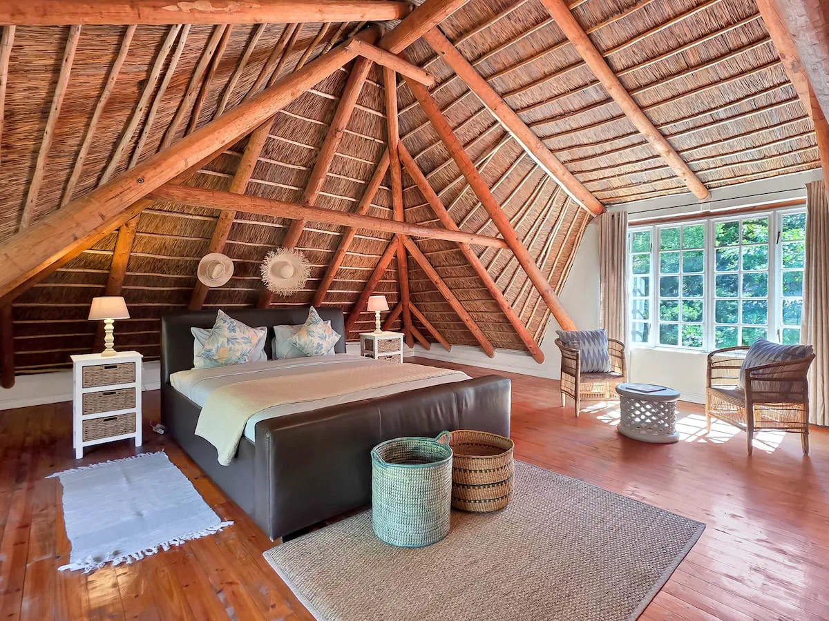 Thatched-roof bedroom at Forest Hideaway Cottage, Hout Bay