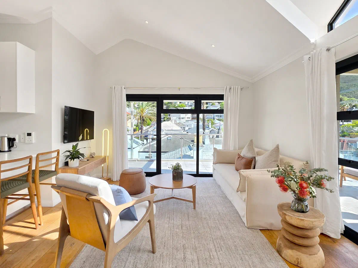 Bright living room with balcony views at The Burnside